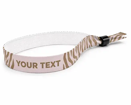 Zebra-striped festival wristbands in pink tones