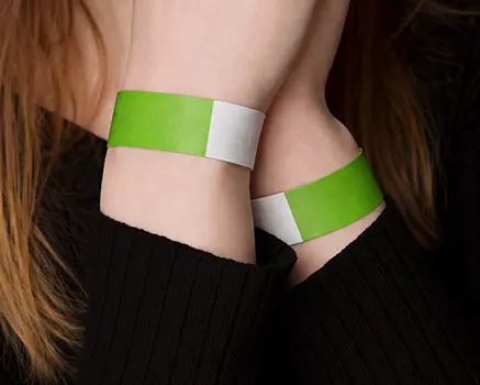 Neon green paper wristbands
