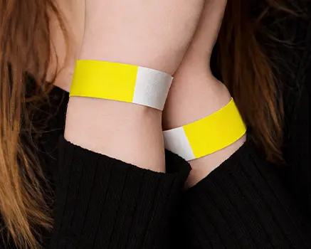 Neon yellow paper wristbands