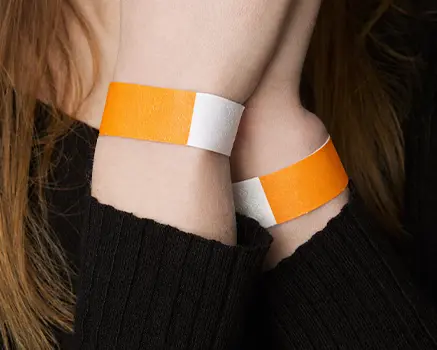 Neon orange paper wristbands