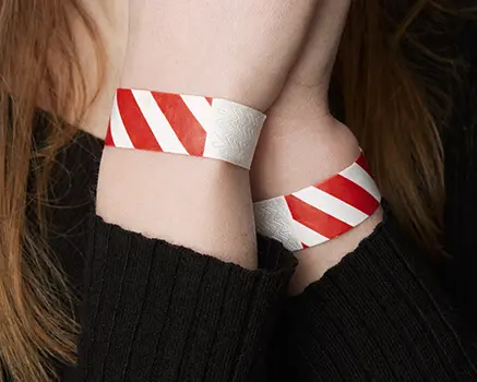 Red and white striped paper wristbands