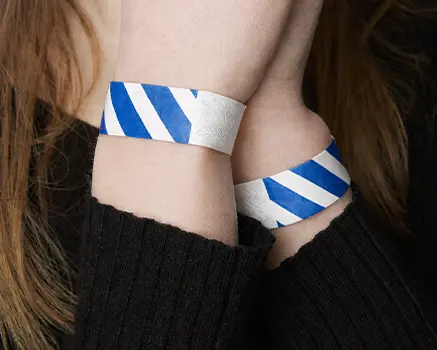Blue and white striped paper wristbands