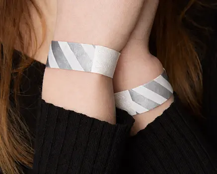 Silver and white striped paper wristbands