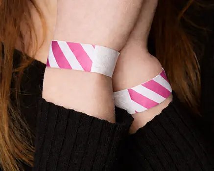 Pink and white striped paper wristbands