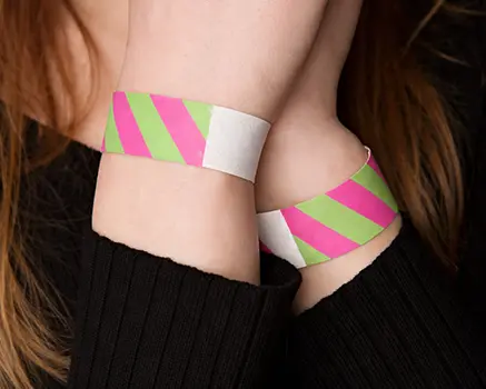 Green and pink striped paper wristbands
